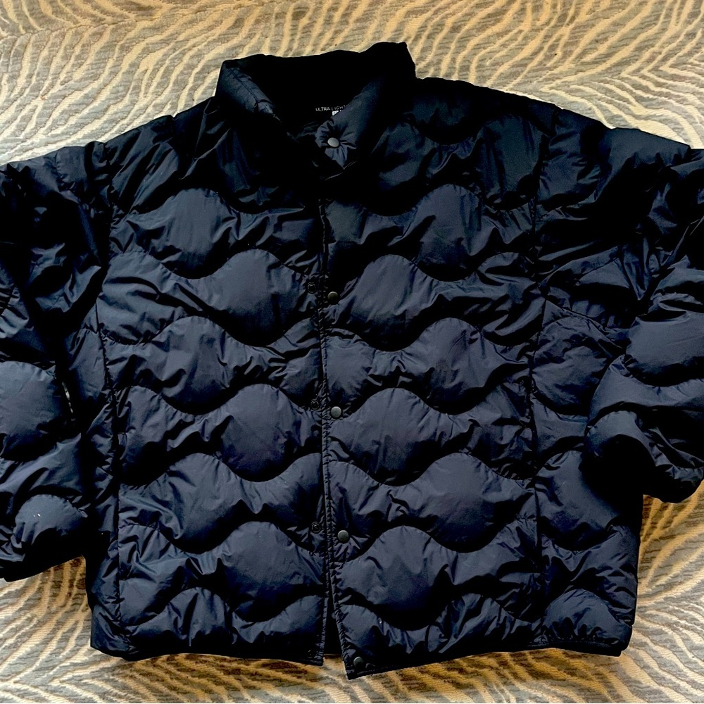 Ultra light uni down jacket. Brand new.